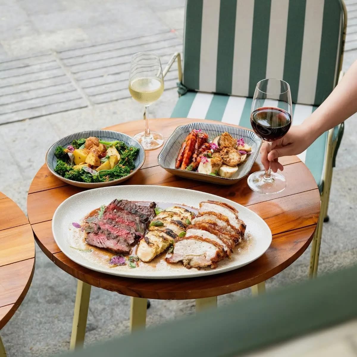 Sunday Roast at La Lola — slow-roasted meats with seasonal sides and wine